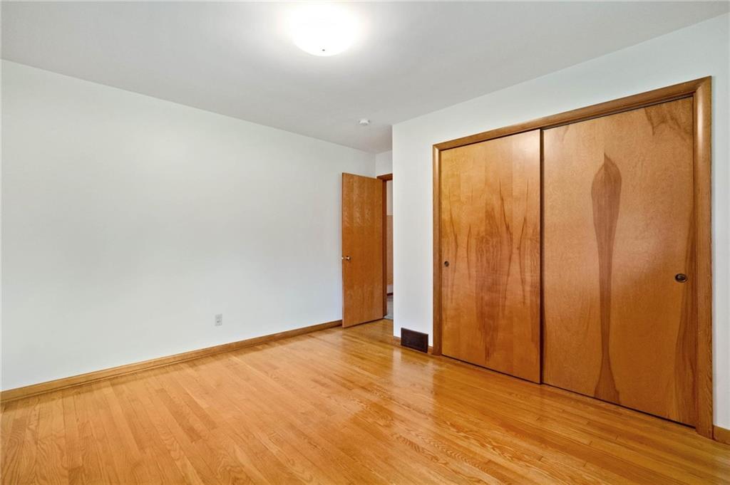 51 Lover Jonestown Road Charleroi, PA 15022 - Photo 15 of 24 a view of an empty room with wooden floor and a window