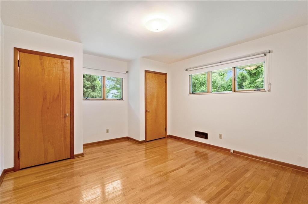 51 Lover Jonestown Road Charleroi, PA 15022 - Photo 17 of 24 an empty room with wooden floor and windows