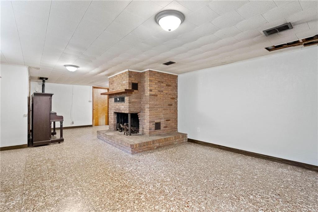 51 Lover Jonestown Road Charleroi, PA 15022 - Photo 19 of 24 an empty room with furniture and a fireplace