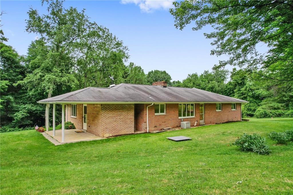 51 Lover Jonestown Road Charleroi, PA 15022 - Photo 23 of 24 a view of a house with a yard potted plants and large tree