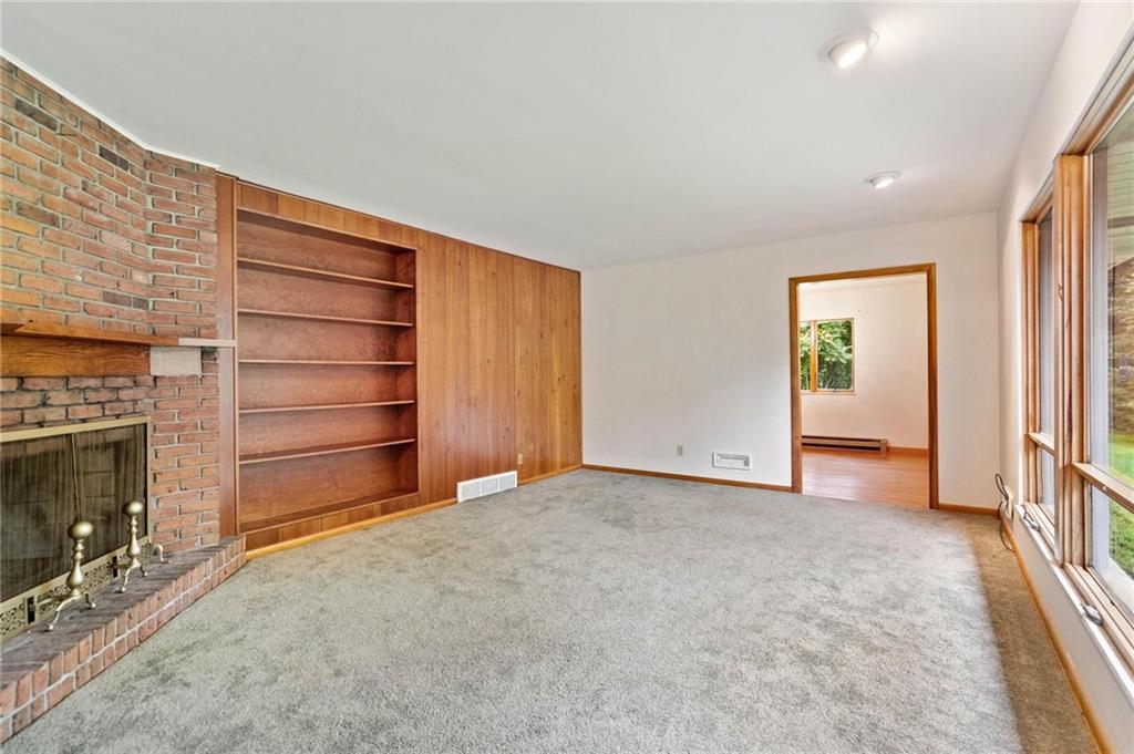 51 Lover Jonestown Road Charleroi, PA 15022 - Photo 3 of 24 a view of an empty room with a fireplace