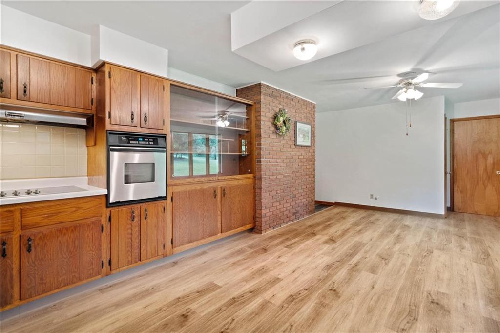 51 Lover Jonestown Road Charleroi, PA 15022 - Photo 9 of 24 a kitchen with stainless steel appliances granite countertop a refrigerator oven a sink dishwasher and wooden cabinets with wooden floor