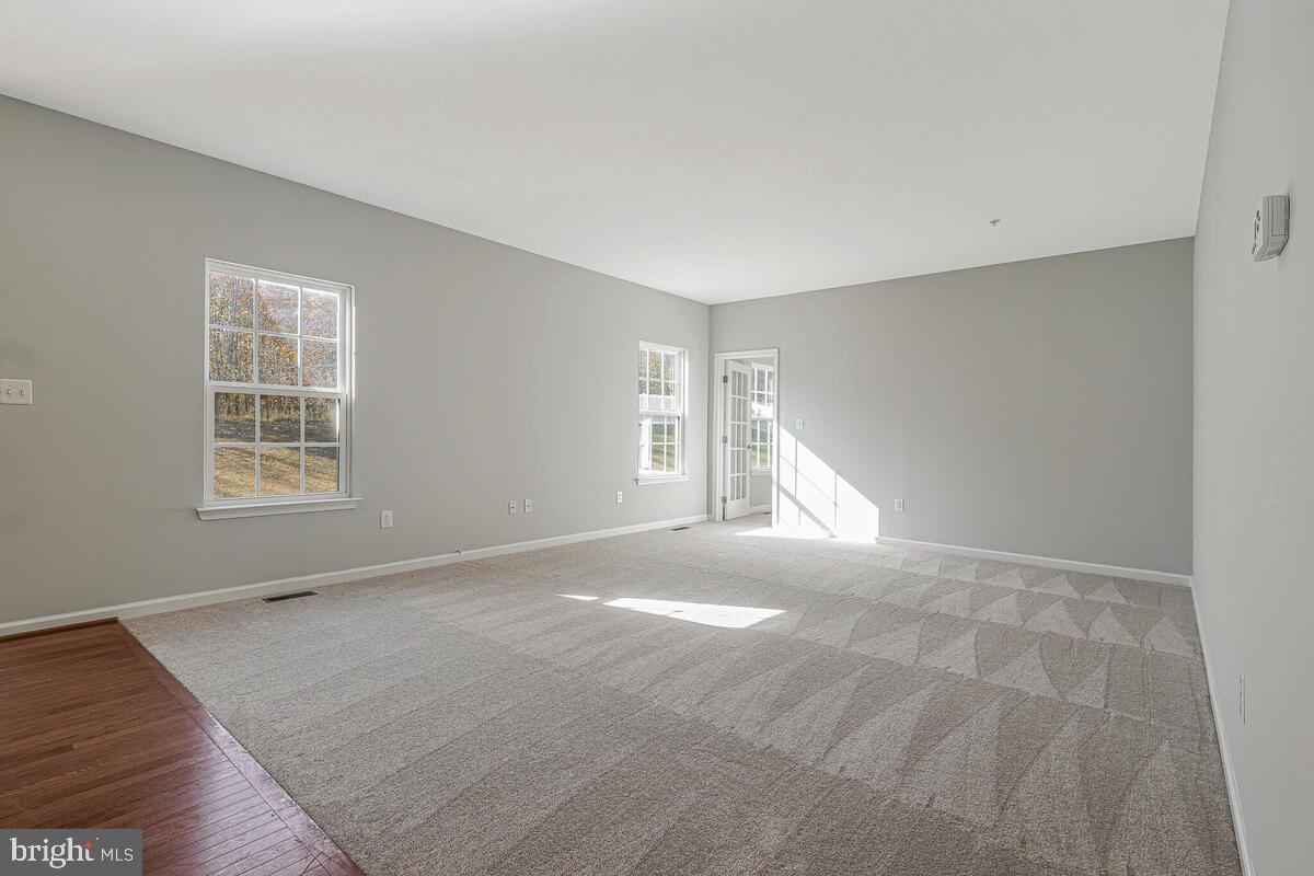 6911 Simmons Lane Clinton, MD 20735 - Photo 15 of 41 a view of empty room with windows
