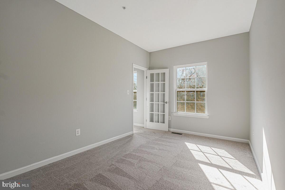 6911 Simmons Lane Clinton, MD 20735 - Photo 18 of 41 an empty room with windows