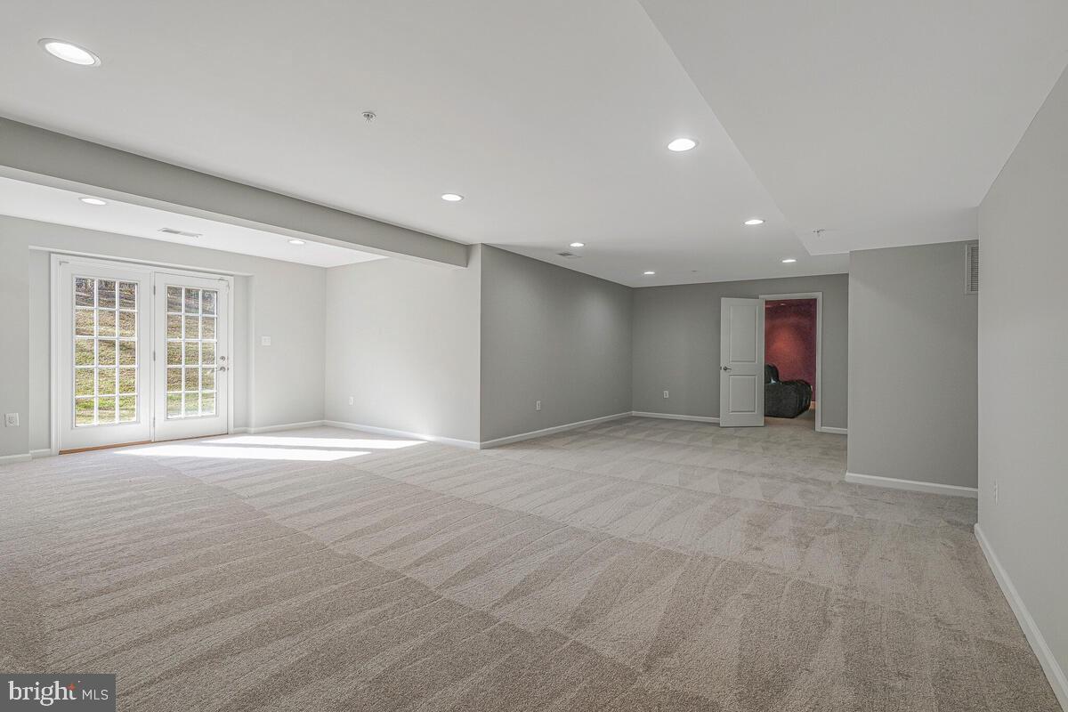 6911 Simmons Lane Clinton, MD 20735 - Photo 19 of 41 a view of an empty room with a window