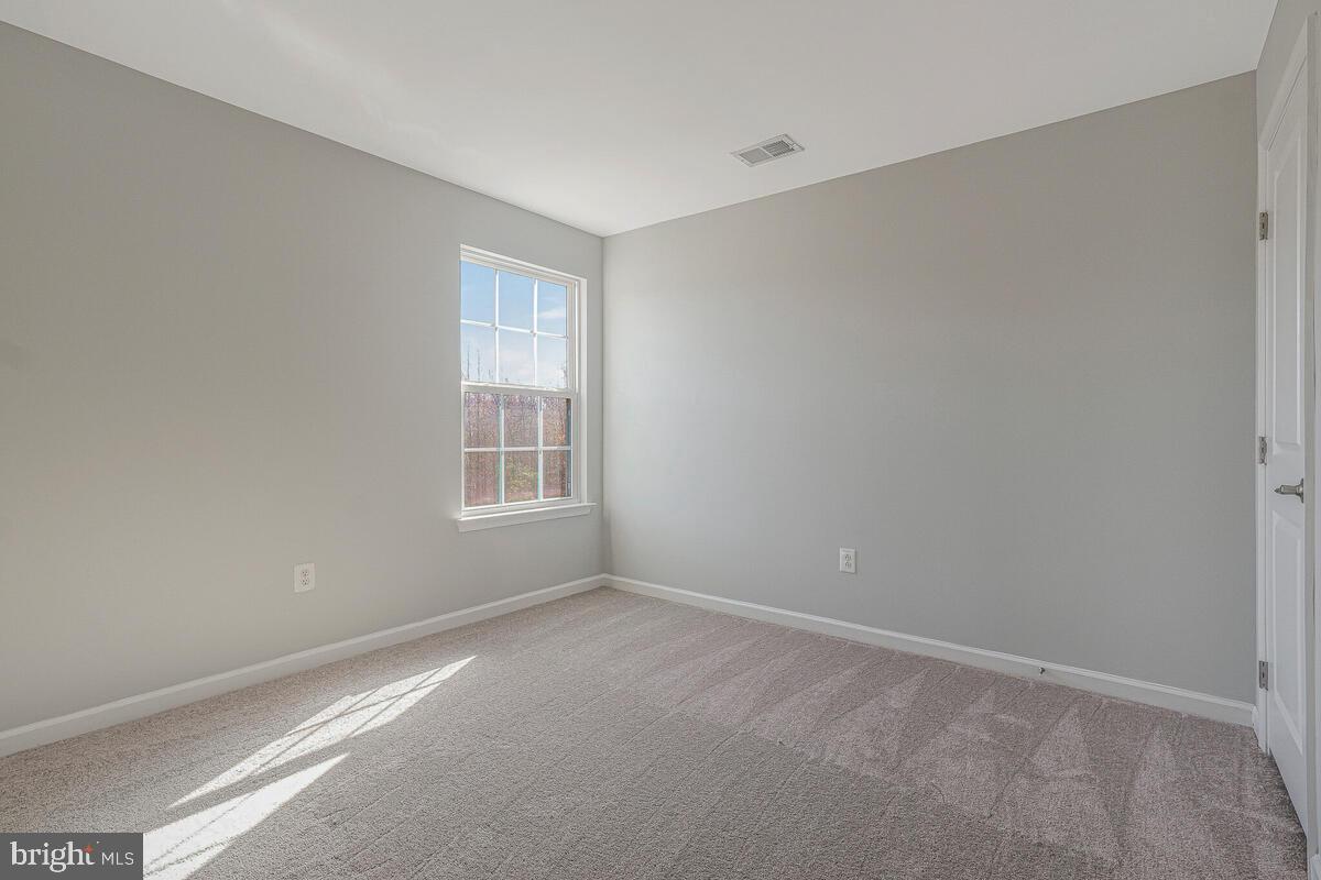 6911 Simmons Lane Clinton, MD 20735 - Photo 24 of 41 a view of an empty room with a window