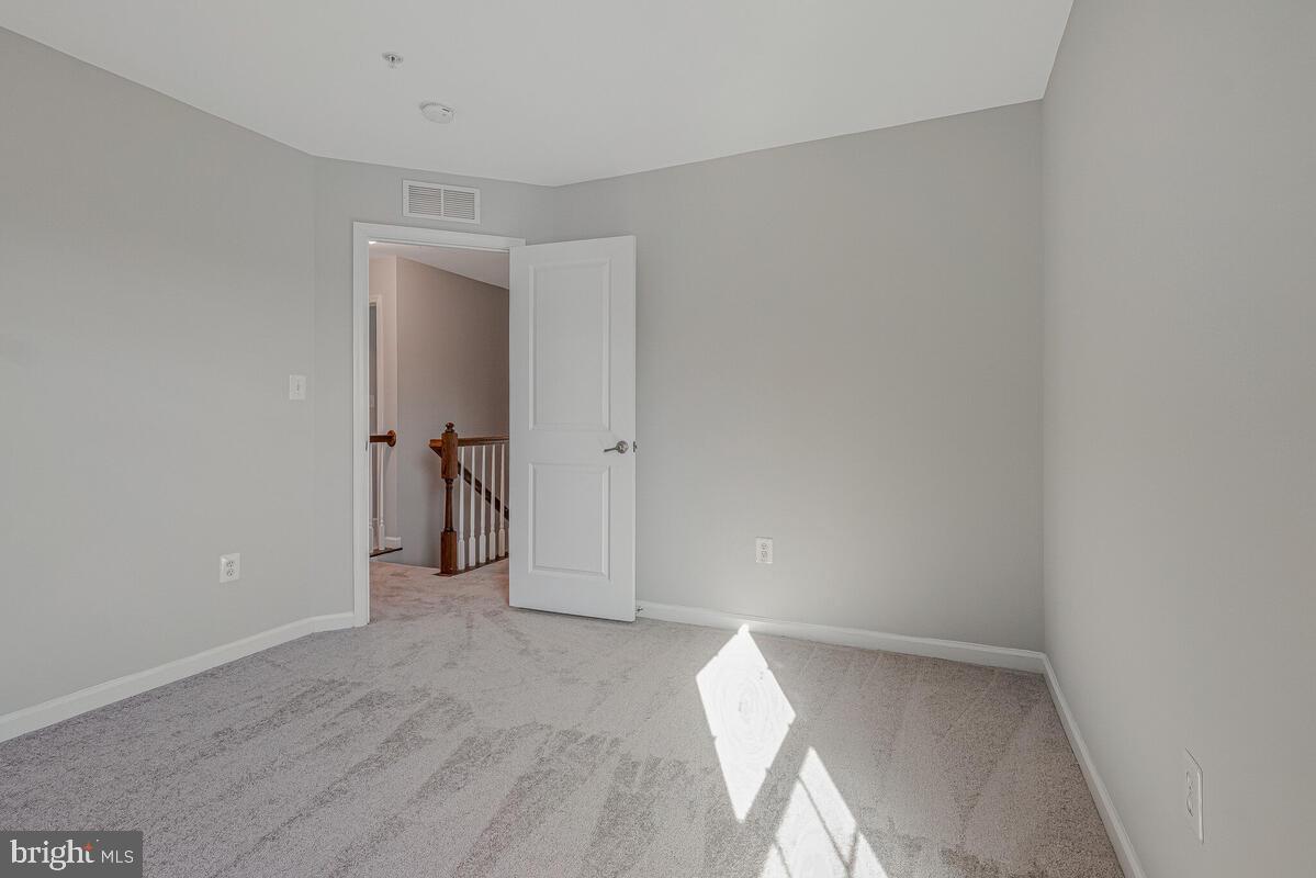 6911 Simmons Lane Clinton, MD 20735 - Photo 25 of 41 a view of a room with an empty space