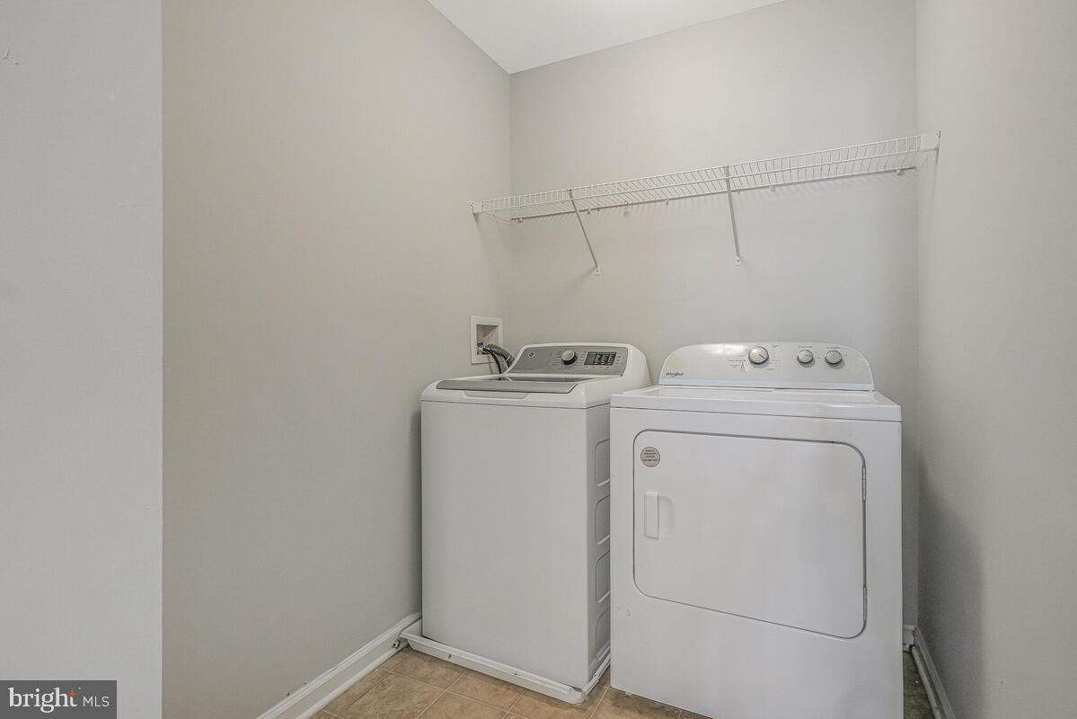 6911 Simmons Lane Clinton, MD 20735 - Photo 26 of 41 a utility room with dryer and washer