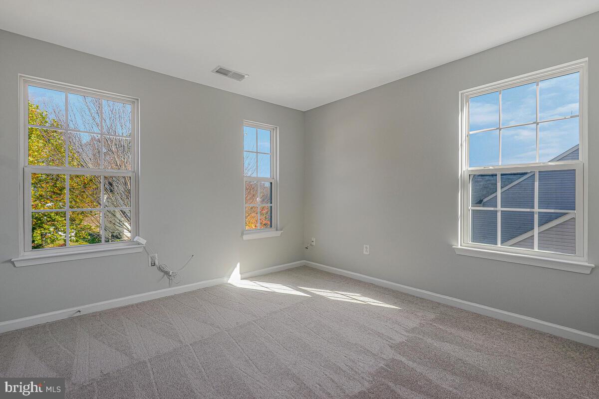 6911 Simmons Lane Clinton, MD 20735 - Photo 27 of 41 an empty room with windows