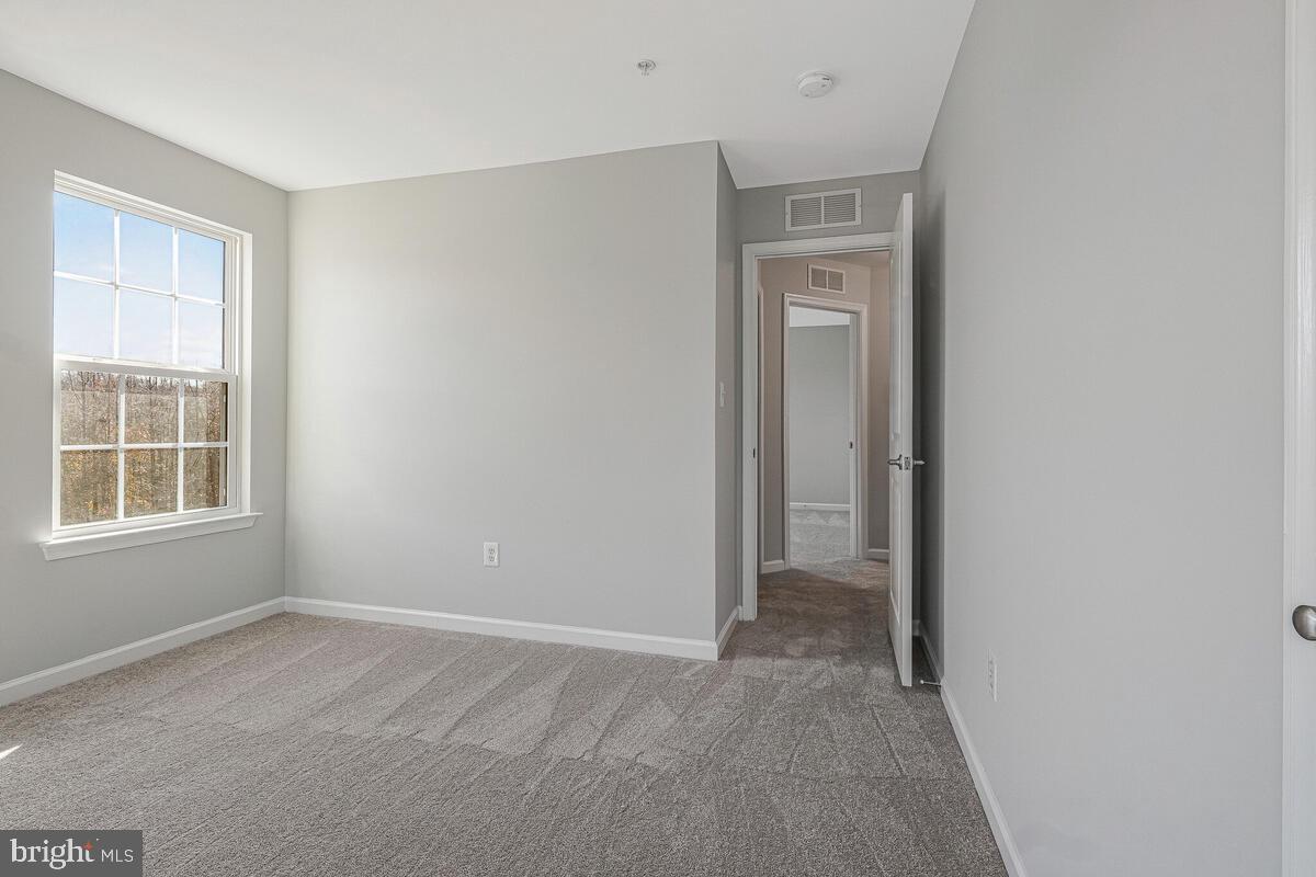 6911 Simmons Lane Clinton, MD 20735 - Photo 28 of 41 a view of an empty room with a window