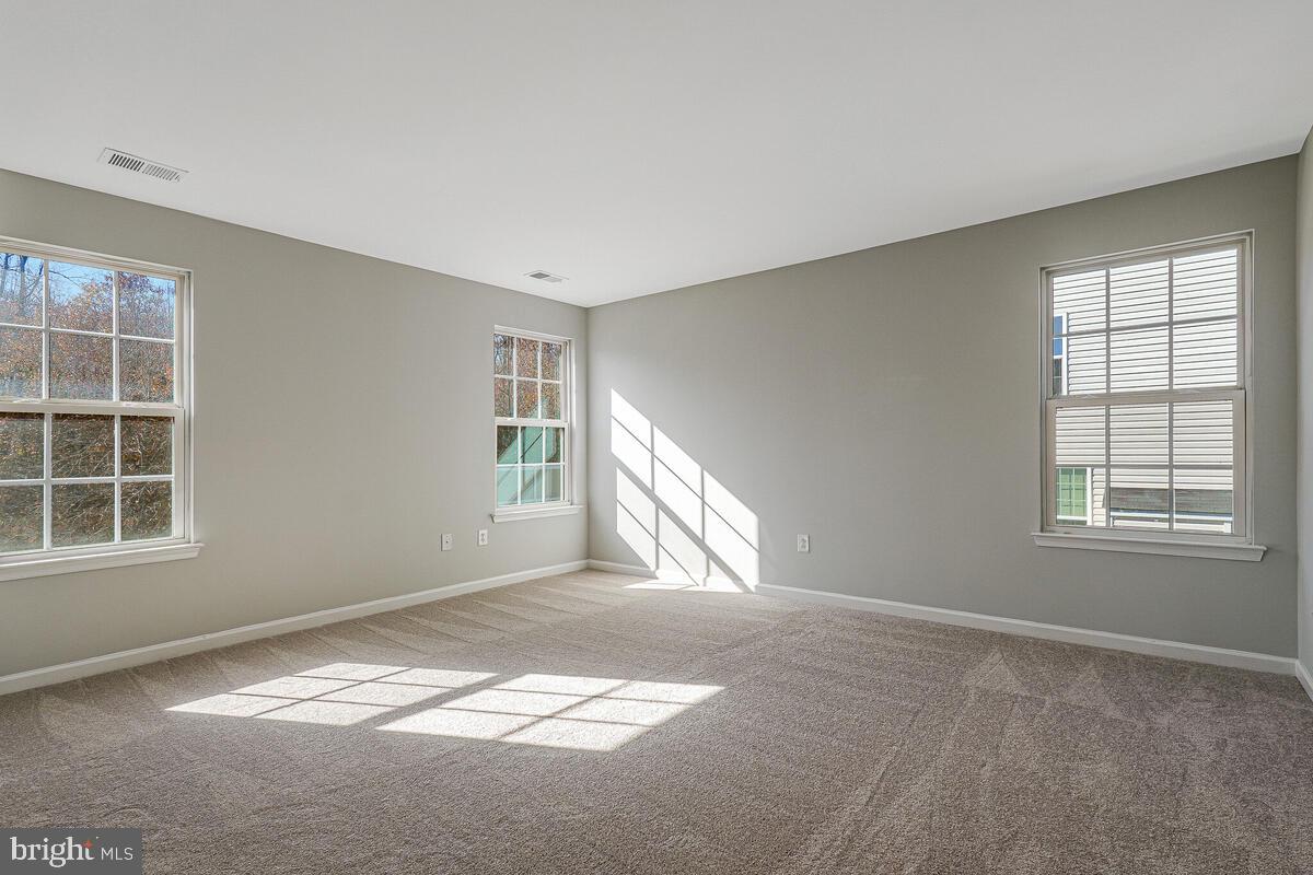 6911 Simmons Lane Clinton, MD 20735 - Photo 32 of 41 a view of an empty room with a window