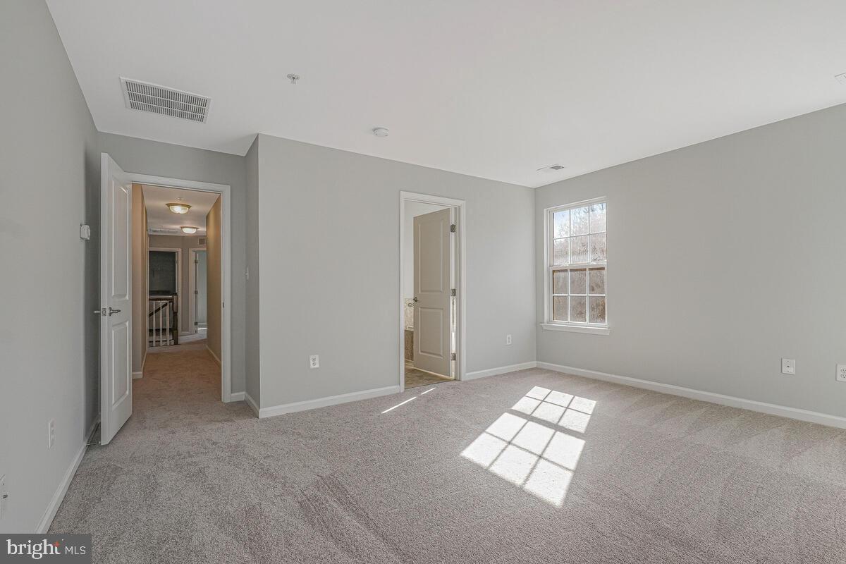 6911 Simmons Lane Clinton, MD 20735 - Photo 33 of 41 a view of empty room with windows
