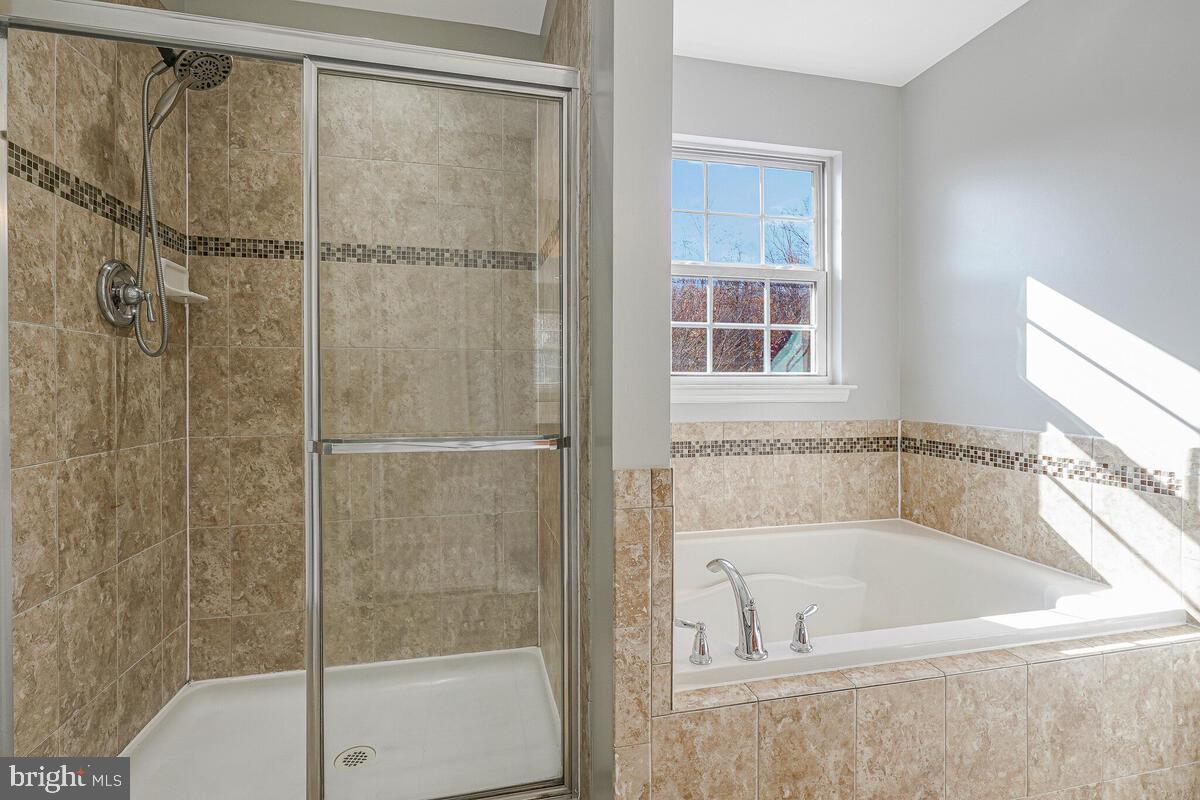 6911 Simmons Lane Clinton, MD 20735 - Photo 36 of 41 a bath tub sitting next to a shower
