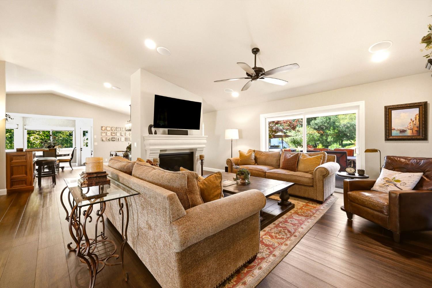 6380 Butterfield Way Placerville, CA 95667 - Photo 25 of 93 a living room with furniture a fireplace and a flat screen tv