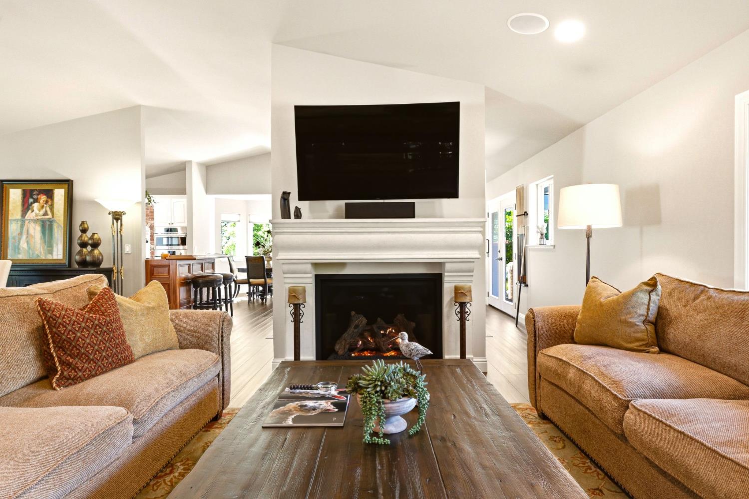 6380 Butterfield Way Placerville, CA 95667 - Photo 26 of 93 a living room with furniture a flat screen tv and a fireplace