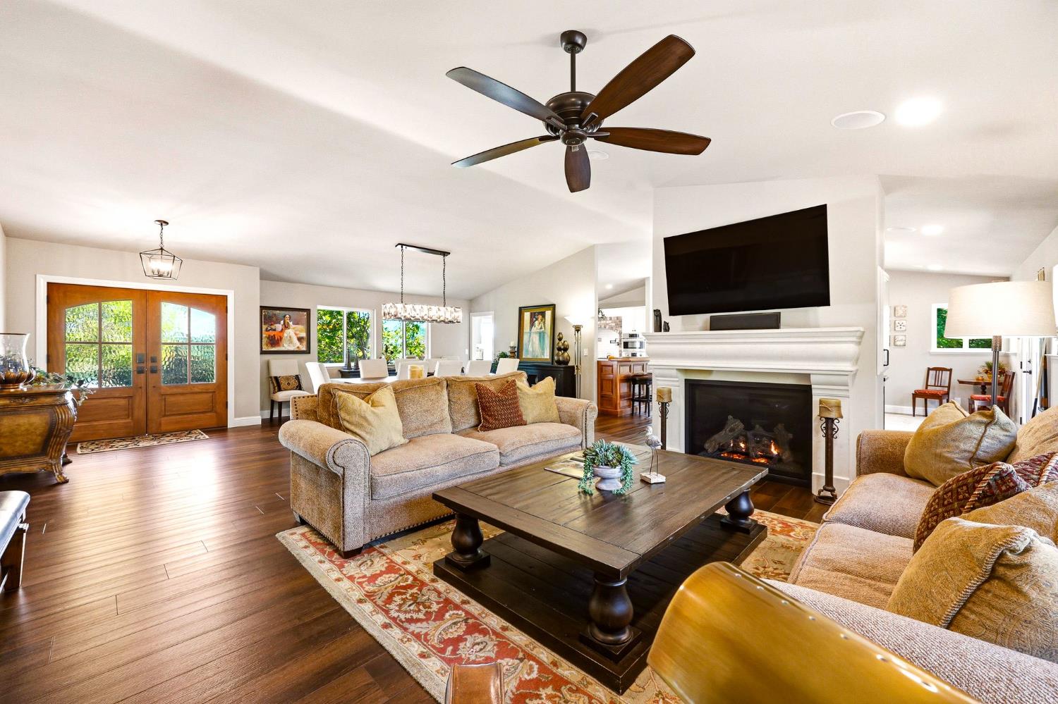 6380 Butterfield Way Placerville, CA 95667 - Photo 3 of 93 a living room with furniture a fireplace and a flat screen tv