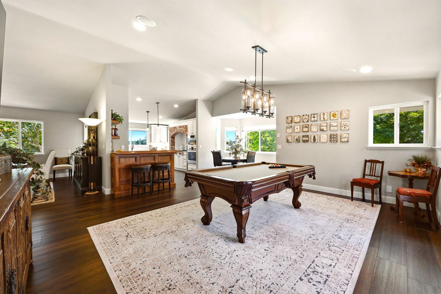 6380 Butterfield Way Placerville, CA 95667 - Photo 35 of 93 a living room with furniture a wooden floor and chandelier