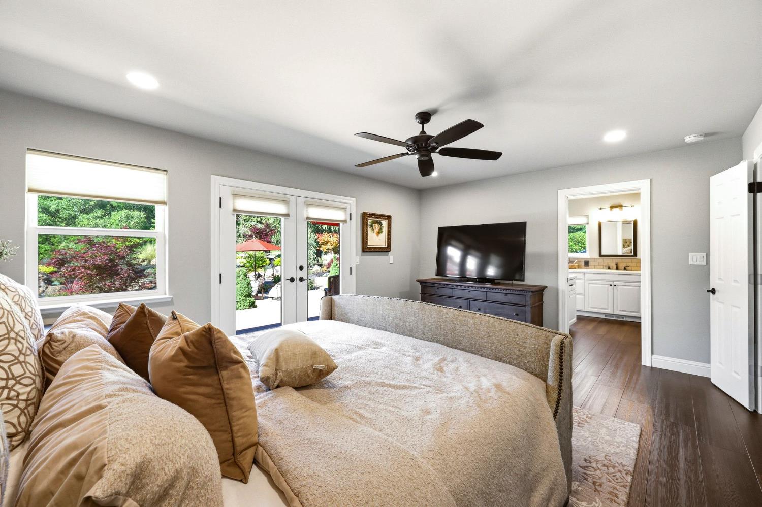 6380 Butterfield Way Placerville, CA 95667 - Photo 42 of 93 a large bedroom with a large bed and a flat screen tv