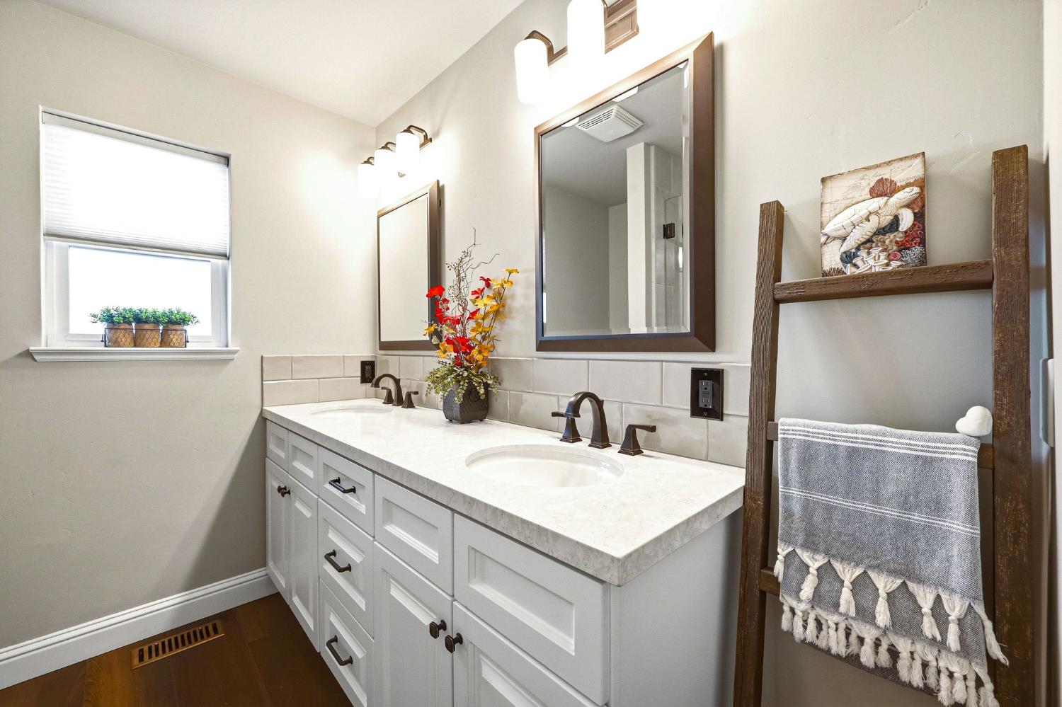6380 Butterfield Way Placerville, CA 95667 - Photo 48 of 93 a bathroom with a sink and a mirror