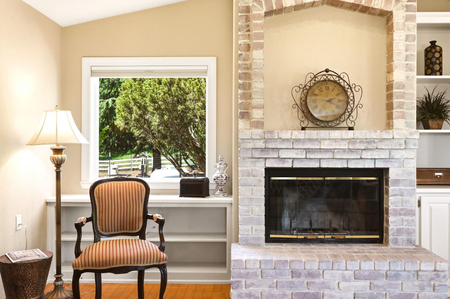 6380 Butterfield Way Placerville, CA 95667 - Photo 71 of 93 a living room with furniture a clock and a fireplace