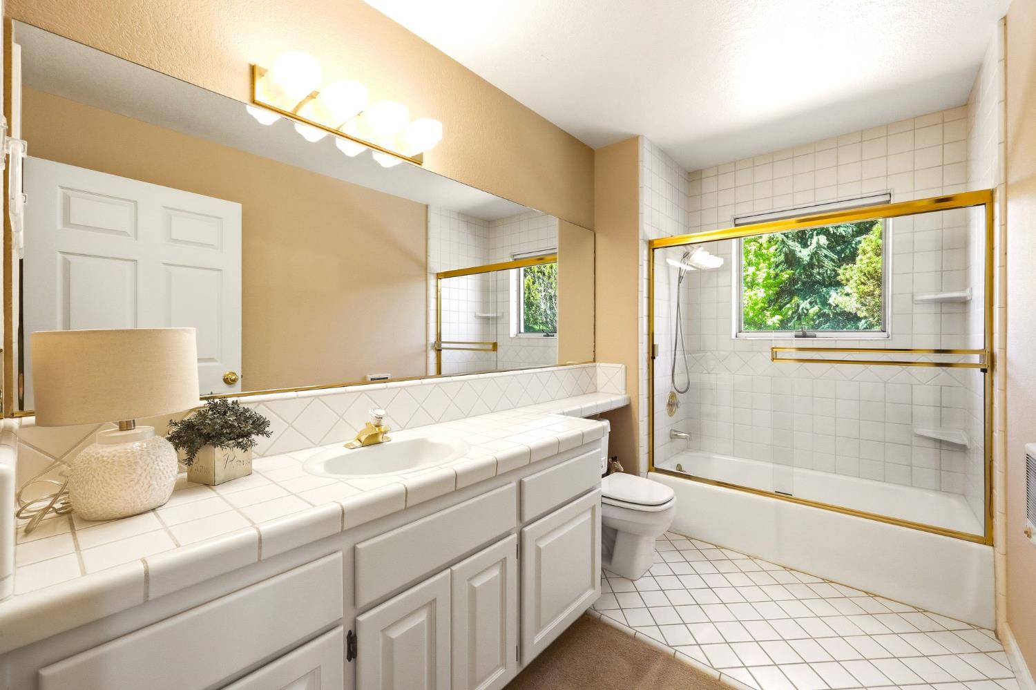 6380 Butterfield Way Placerville, CA 95667 - Photo 72 of 93 a bathroom with a double vanity sink toilet and shower