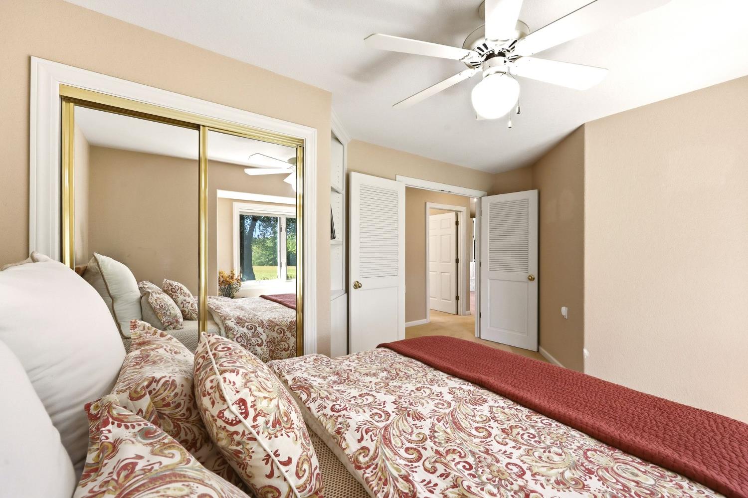 6380 Butterfield Way Placerville, CA 95667 - Photo 74 of 93 a bedroom with a large bed and a chandelier