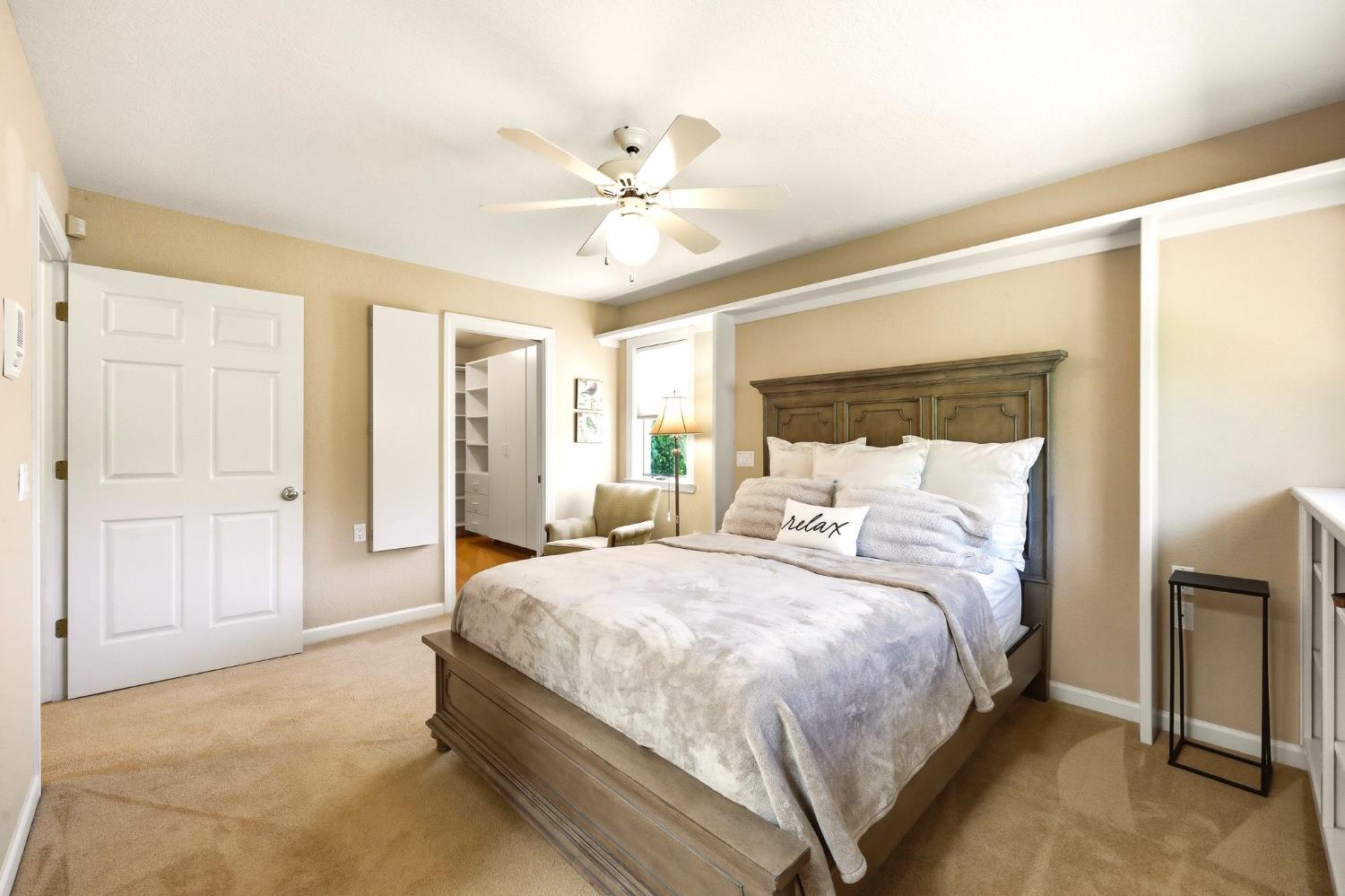 6380 Butterfield Way Placerville, CA 95667 - Photo 77 of 93 a bedroom with a bed and a chandelier