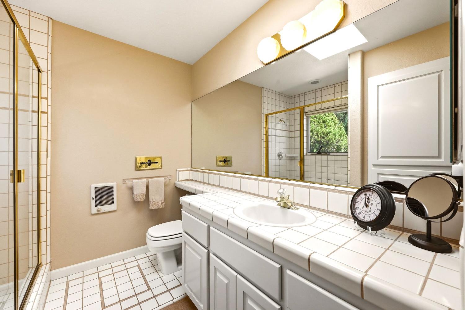 6380 Butterfield Way Placerville, CA 95667 - Photo 78 of 93 a bathroom with a granite countertop sink and a large mirror