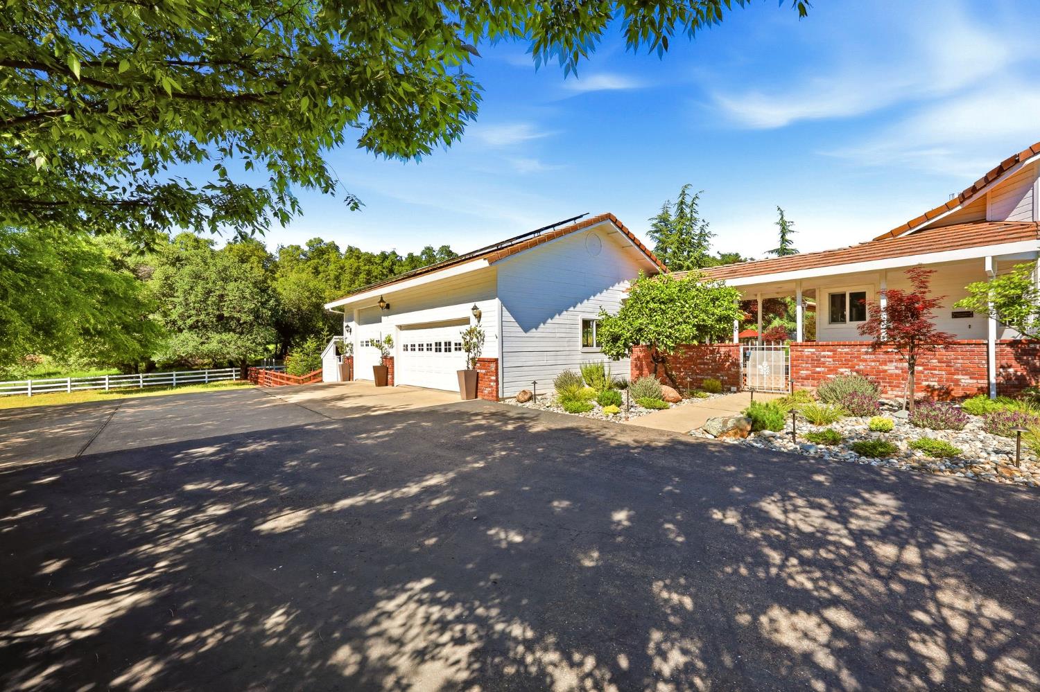6380 Butterfield Way Placerville, CA 95667 - Photo 84 of 93 a front view of a house with a yard and a garage