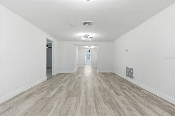 a view of gallery with wooden floor