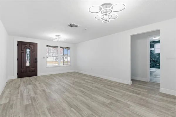 a view of an empty room with a window