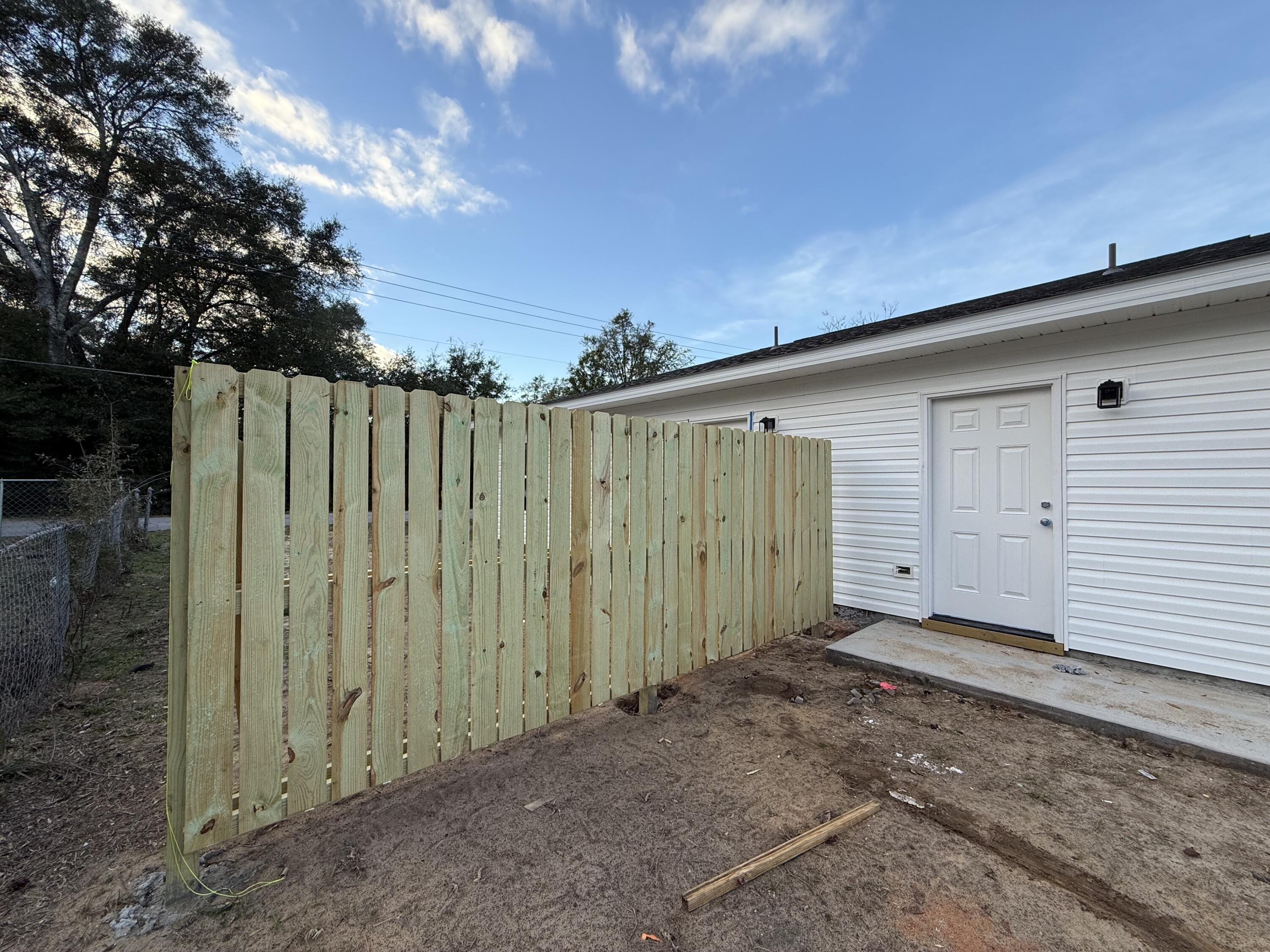 32 Constitution Avenue, Unit AB DeFuniak Springs, FL 32433 - Photo 12 of 13 a view of a backyard