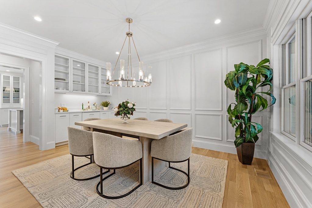 126 Prince Street Needham, MA 02492 - Photo 12 of 26 a view of a dining room with furniture wooden floor and chandelier