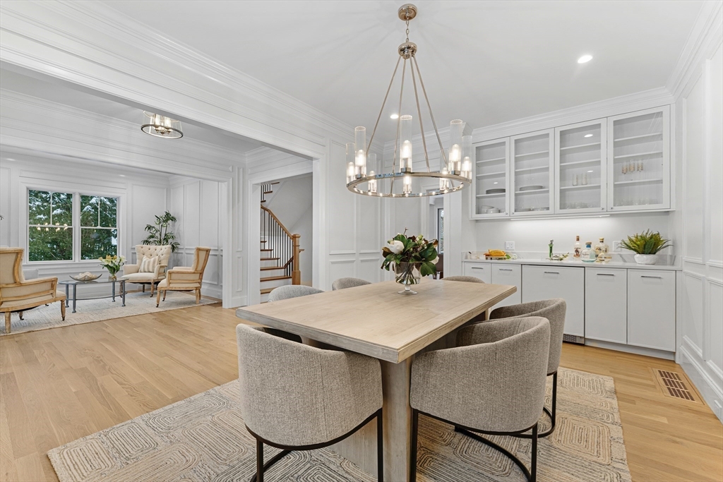 126 Prince Street Needham, MA 02492 - Photo 13 of 26 a view of a dining room with furniture and chandelier