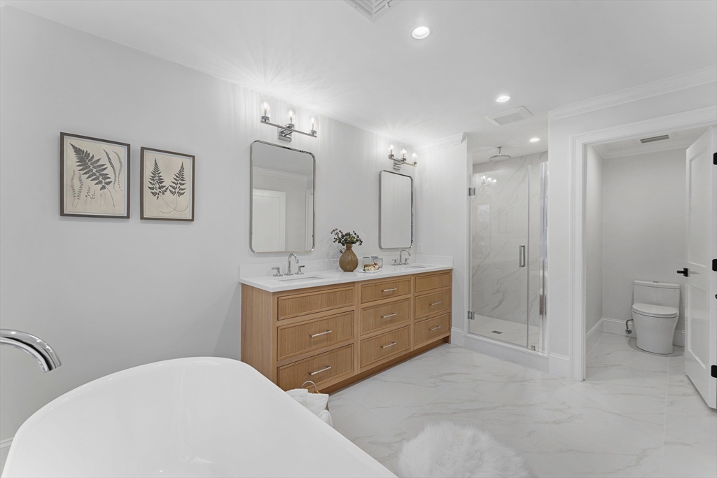 126 Prince Street Needham, MA 02492 - Photo 15 of 26 a spacious bathroom with a double vanity sink mirror and toilet