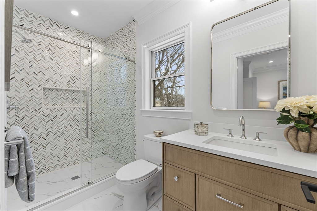 126 Prince Street Needham, MA 02492 - Photo 17 of 26 a bathroom with a sink a toilet and shower