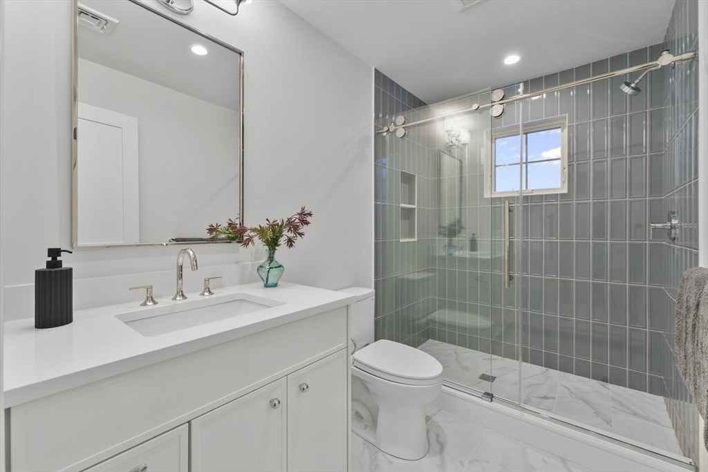 126 Prince Street Needham, MA 02492 - Photo 19 of 26 a bathroom with a sink toilet and shower