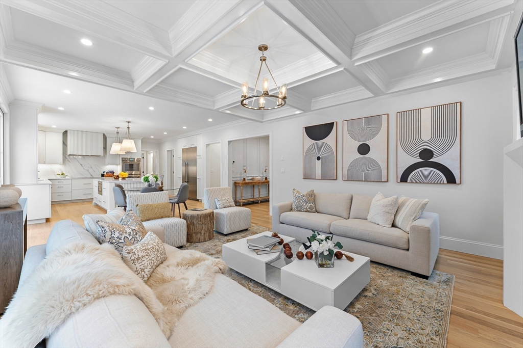 126 Prince Street Needham, MA 02492 - Photo 5 of 26 a living room with furniture kitchen view and a chandelier