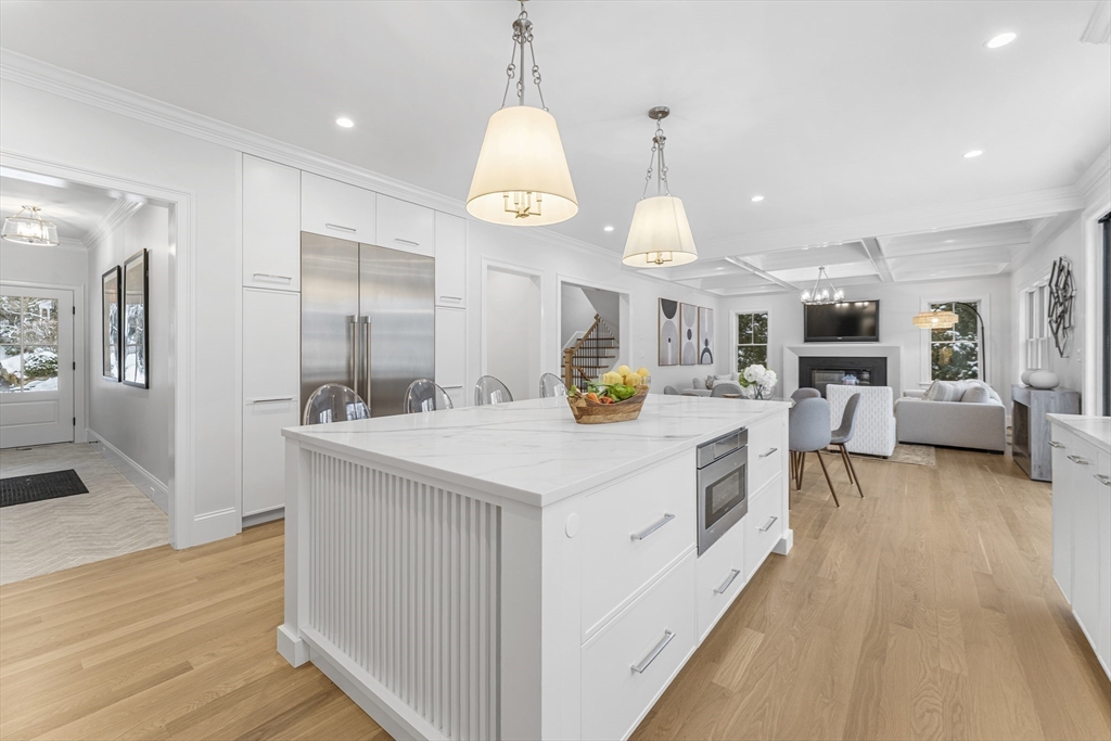 126 Prince Street Needham, MA 02492 - Photo 9 of 26 an open kitchen with a table and chairs in it