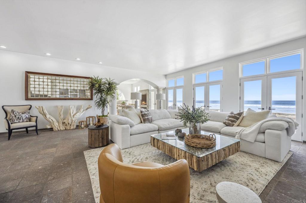 1716 Ocean Front Del Mar, CA 92014 - Photo 11 of 61 a living room with furniture potted plant and a large window