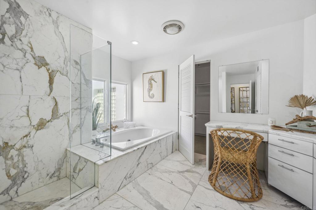 1716 Ocean Front Del Mar, CA 92014 - Photo 30 of 61 a spacious bathroom with a granite countertop sink and a mirror