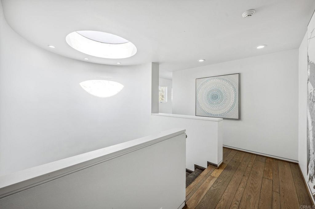 1716 Ocean Front Del Mar, CA 92014 - Photo 42 of 61 a view of a room with wooden floor and white walls