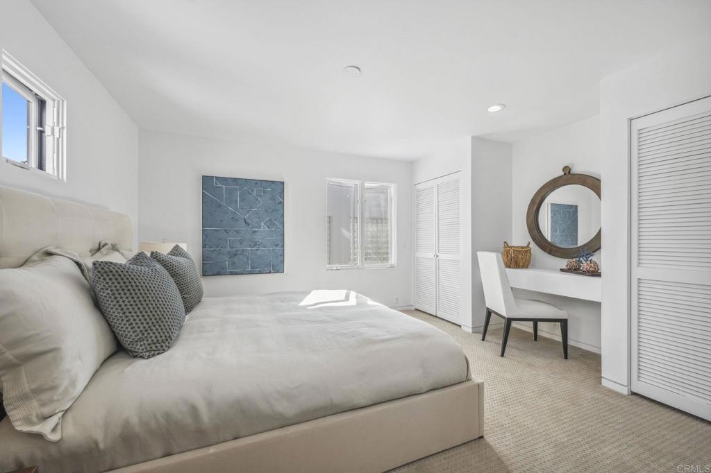1716 Ocean Front Del Mar, CA 92014 - Photo 45 of 61 a bedroom with a bed and a cabinets