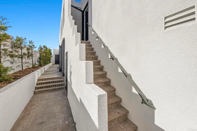 a balcony with furniture and wooden floor