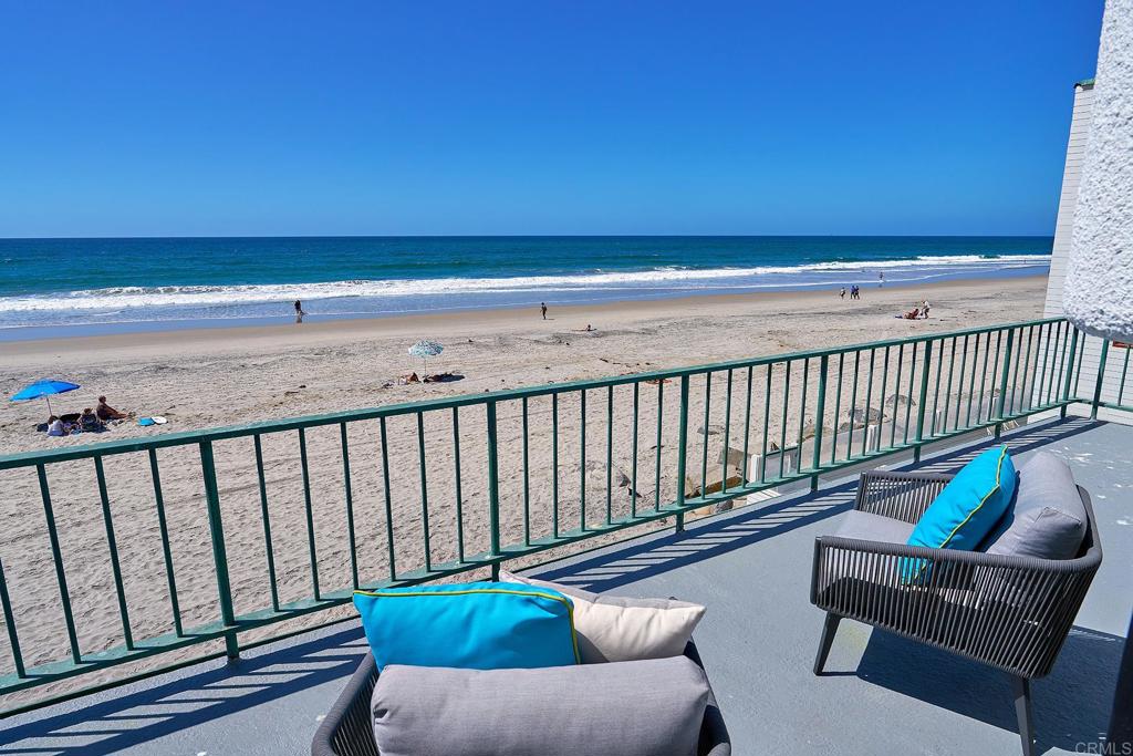 1716 Ocean Front Del Mar, CA 92014 - Photo 59 of 61 a balcony with furniture and wooden floor