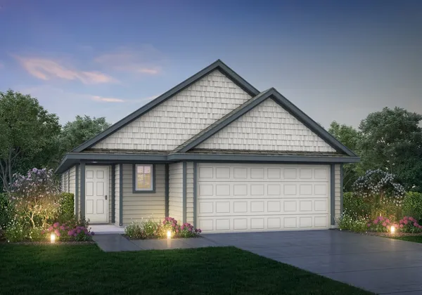 a view of a house with a small yard and potted plants