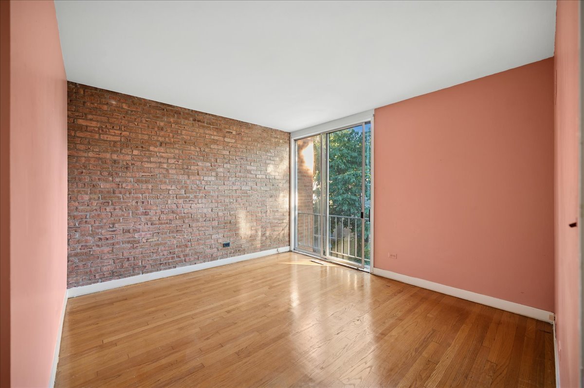 471 Linden Street Winnetka, IL 60093 - Photo 30 of 36 a view of an empty room with wooden floor and a window
