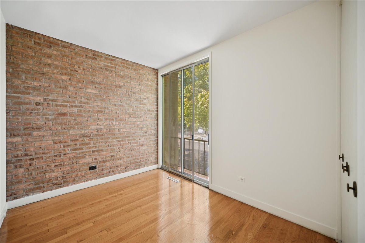 471 Linden Street Winnetka, IL 60093 - Photo 33 of 36 a view of an empty room with wooden floor and a window