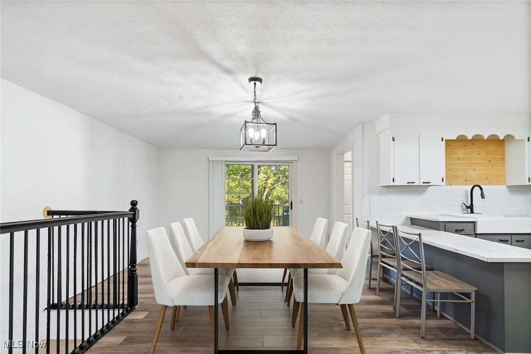 Living area with a baseboard radiator and baseboards Virtually staged