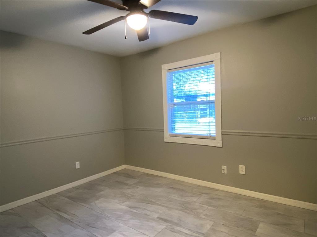 39656 Meadowood Loop Zephyrhills, FL 33542 - Photo 14 of 30 an empty room with a window